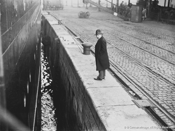 28 March 1933, Antwerp, Belgium. Jewish physicist Albert Einstein (Ulm, 1879 - Princeton, New Jersey, 1955) pictured near the Red Star Line ocean liner " Belgenland ", on which he and his wife were supposed to return to Germany via Antwerp after their visit to the USA. However, during this journey, Einstein learned that the Nazis had confiscated all their possessions and had begun a smear campaign against all Jews. For that reason, he announced that he would not return to his home city after the boat had docked in Antwerp. Image by (c) Germaine Van Parys - GermaineImage